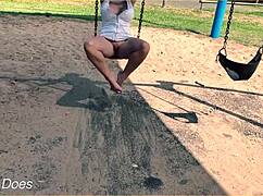 wife swings carefree on playground swing flashing shaved pussy no panties underneath