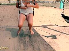 wife swings carefree on playground swing flashing shaved pussy no panties underneath