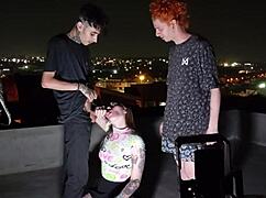 young tattooed goddess dominates two monster cocks bareback on the roof with feet worship