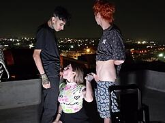 young tattooed goddess dominates two monster cocks bareback on the roof with feet worship