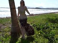 watch this sexy belly dancer shake her big tits and ass