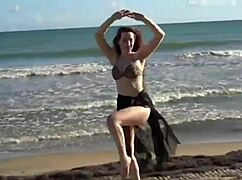 watch this sexy belly dancer shake her big tits and ass