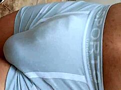 guy's hard cock bulging in tight outdoor shorts