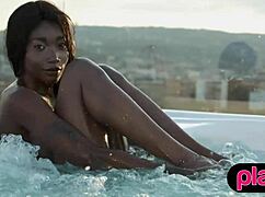 hey petite ebony milf slowly strips juicy tits poolside showing off curves