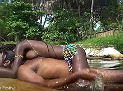 Skinny ebony tribe girl from Africa spreads pussy outdoors in the forest!