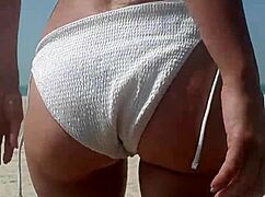 Fat ass white girl pees in bikini right on crowded public beach outdoors