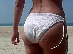 Fat ass white girl pees in bikini right on crowded public beach outdoors