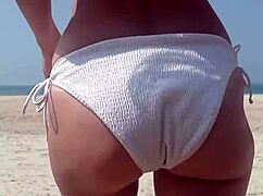 Fat ass white girl pees in bikini right on crowded public beach outdoors