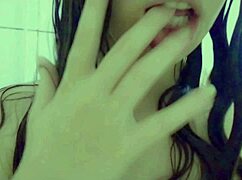 just a cute student enjoys her wet shaved pussy in the shower