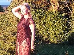 grandma flashes natural tits in sheer bodysuit while wearing heels outside