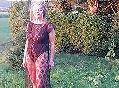 grandma flashes natural tits in sheer bodysuit while wearing heels outside
