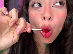 girl with split tongue licks lollipop and puts in ass
