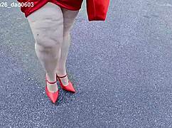 beautiful woman walking outdoors in public parking lot showing off for strangers