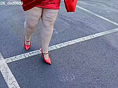 beautiful woman walking outdoors in public parking lot showing off for strangers