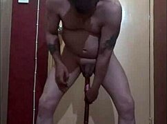 bisexual male inserts a dildo on a stick up his ass and starts riding it till he creams