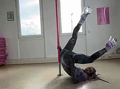 Anuskatzz dances on the pole with goth energy