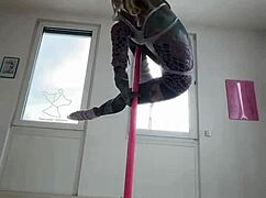 Anuskatzz dances on the pole with goth energy