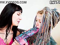 Inked hippie girl takes hard anal from goth with big dildo